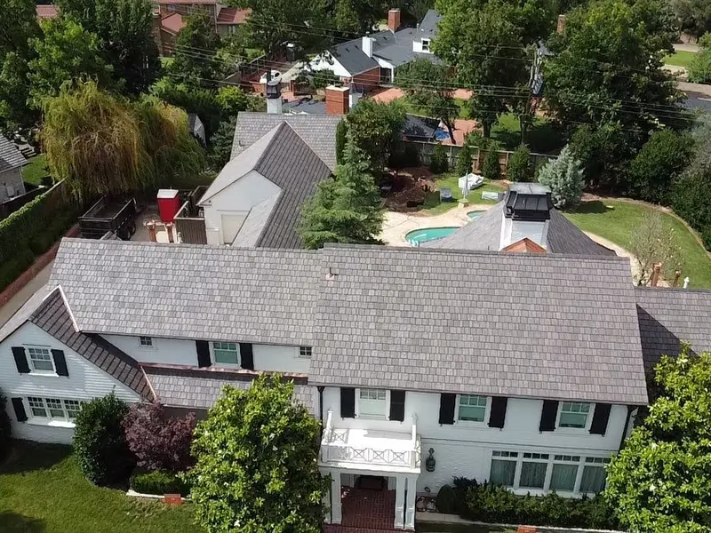 White colonial home with a DaVinci synthetic shake roof