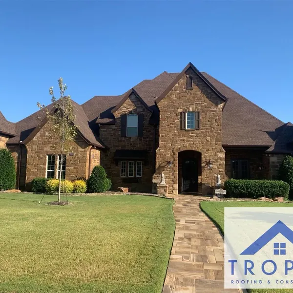 Stone home with turreted rooflines
